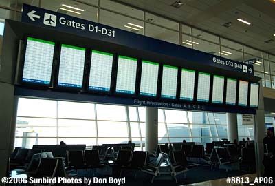 FIDS (Flight Information Display System) screens at Terminal D at Dallas Ft. Worth International Airport stock photo #8813