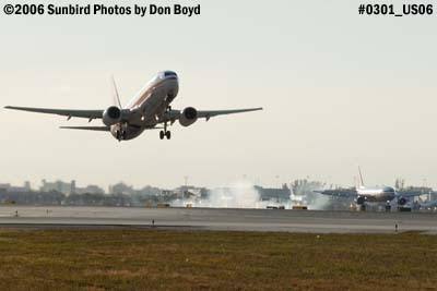 American Airlines B737-823 taking off on 8R and another AA lands on 8L aviation stock photo #0301