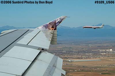 American Airlines MD-80 on parallel approach to DEN, from Frontier A319-111 N929FR Larry the Lynx aviation stock photo #9109