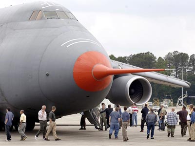 USAF, congressional dignitaries and local attendees checking out modernized C-5M transport