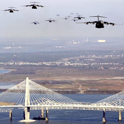 A large formation of USAF C-17 Globemaster IIIs flying over the Arthur Ravenel Bridge in Charleston