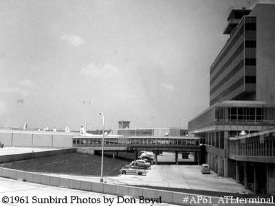1961 - Atlanta Municipal Airport's one-month old terminal viewed from taxiing Delta Airlines DC-7B N4890C aviation stock photo
