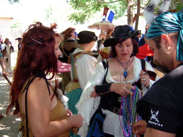 Mariposa, Hurricane checking out Troys beads.