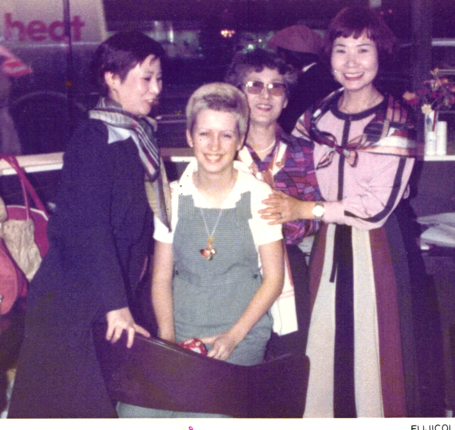 Julie Fletcher posing with some Japanise fans.