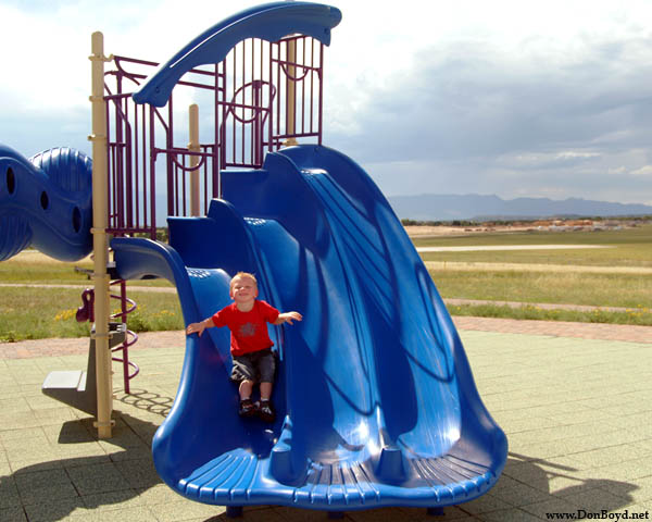 July 2009 - Kyler on the small slide at playground at Peterson AFB, Colorado