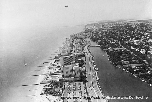 1950s - aerial view of Miami Beach depicting Collins Avenue, the Edec Roc and Fontainebleau Hotels
