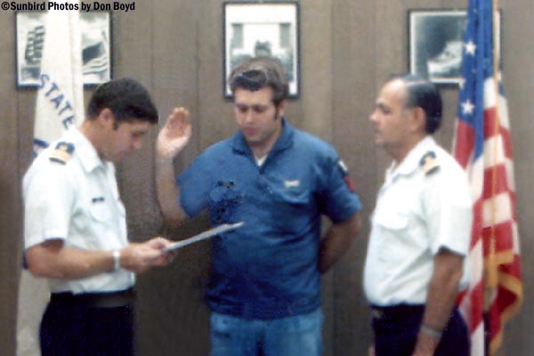 Mid 70s - CDR John T. Mason reenlisting PO1 with LCDR Walter Livingstone