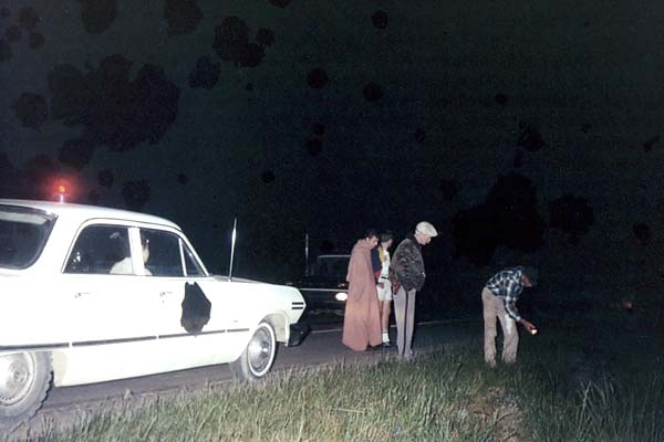 1966 - Bob Zimmerman (middle in blanket)and Jack Sullivan in shorts with sheriffs deputy and rancher and his injured cow