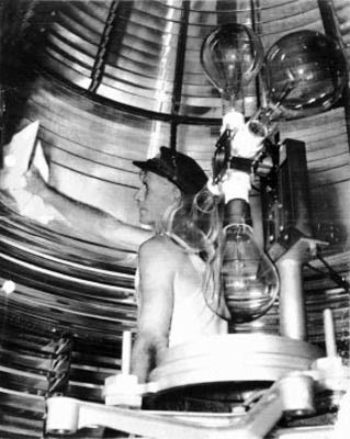 1930's - Fowey Rocks Lighthouse Keeper Hamilton Hamp Sharpe Perry polishing the Fowey Rocks Light Fresnel Lens