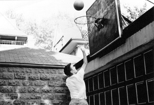 Ken playing basketball in Bobby Larkins driveway on Dorchester Road, Brooklyn. (2) (late 1950s)