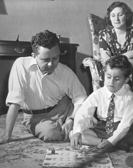 Richard and his father Paul play a game while Hilda (Richard's mother) watches (1948)