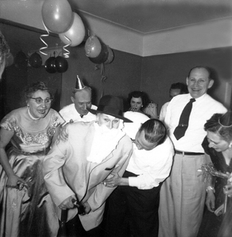 New Years eve party (mother's side). Aunt Clara is father time. (circa 1950)