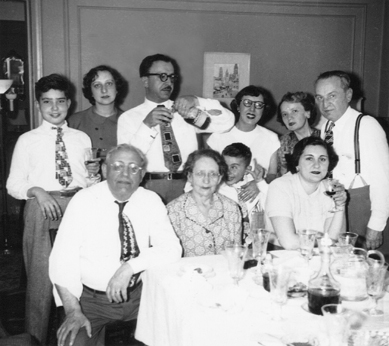 Passover seder at grandparents' (Gussie & Charles) apartment  in the Bronx. Richard is behind grandma Gussie. (1949)