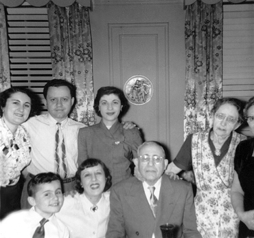 Passover seder (father's side) at grandparents' (Gussie and Charles) apartment in the Bronx. Richard is front left. (1951)
