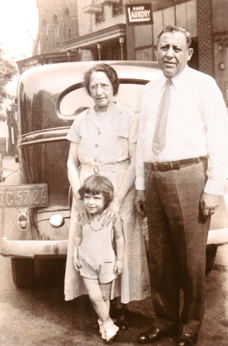 Grandma Gussie and grandpa Charles (fathers side) with a little girl (1935)