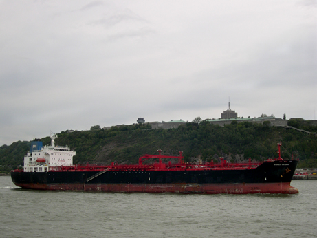 Photo from a ferry going from Qubec City to Lvis. Foreground - a barge. Background - the Citadel.