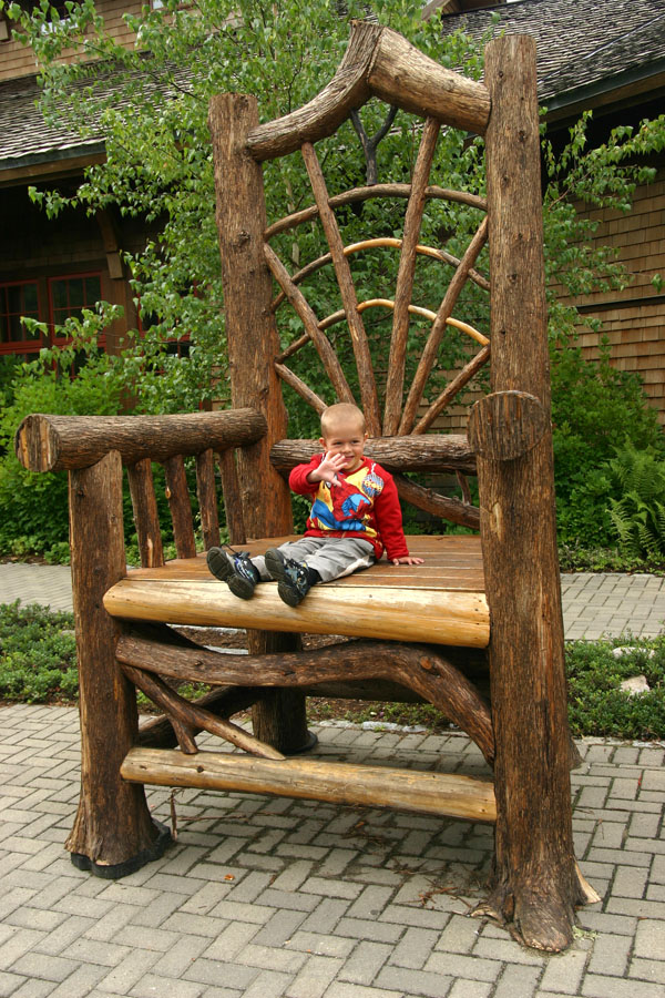 Giant rustic chair at the entrance to the Adirondack museum.