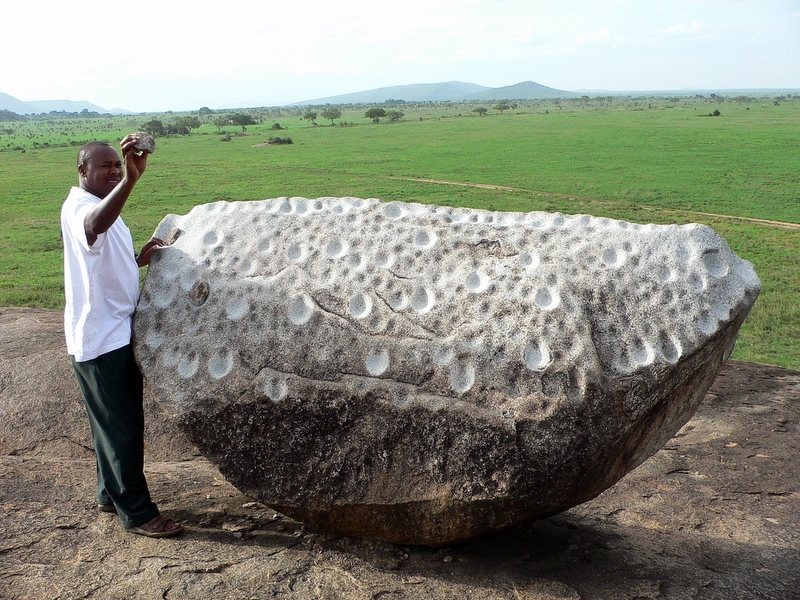  Alex Demonstrating a Gong Rock Used by the Maasai to Signal Across the Plains