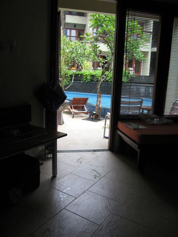sitting on my bed looking out the door at the pool