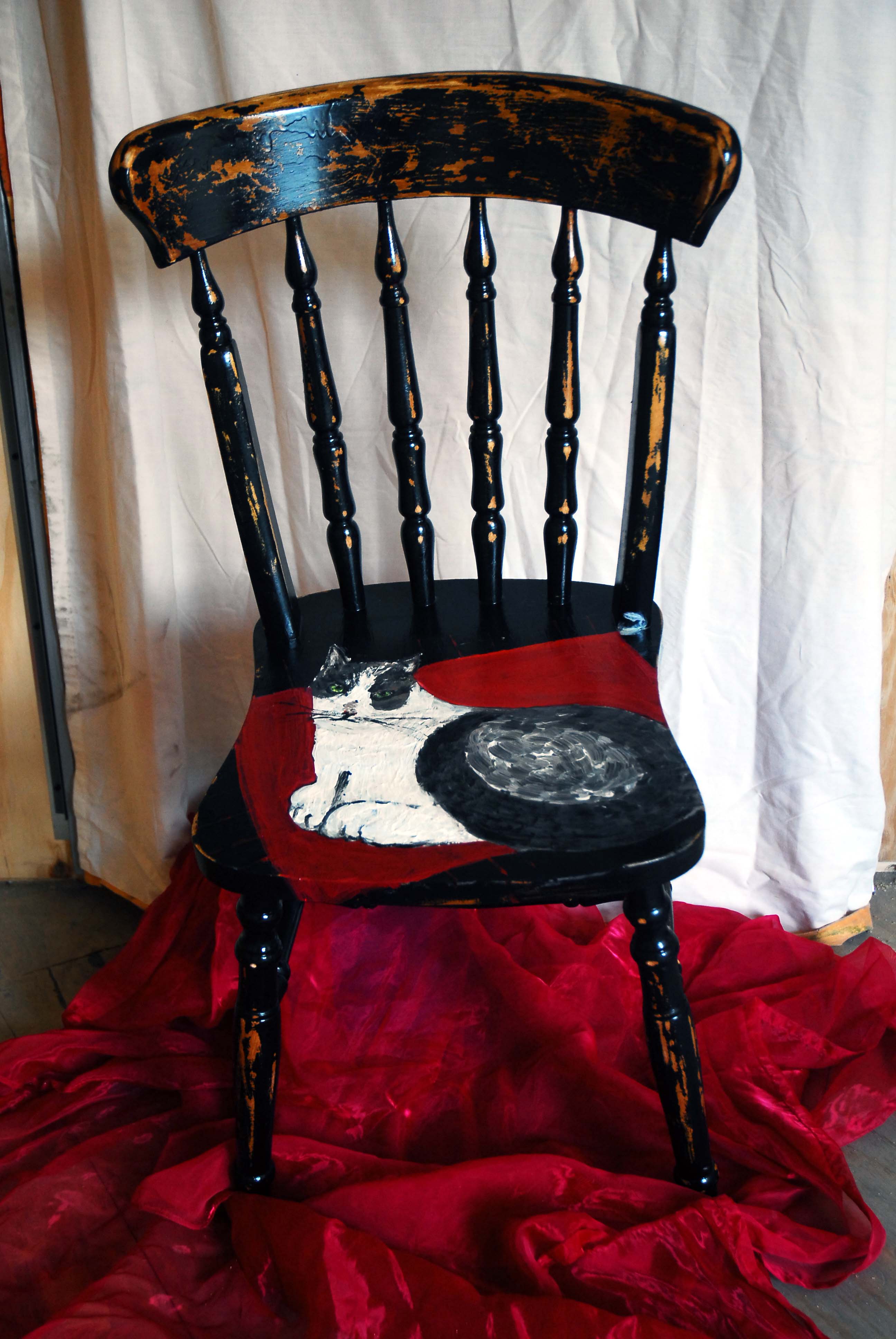 Painted cat on a chair