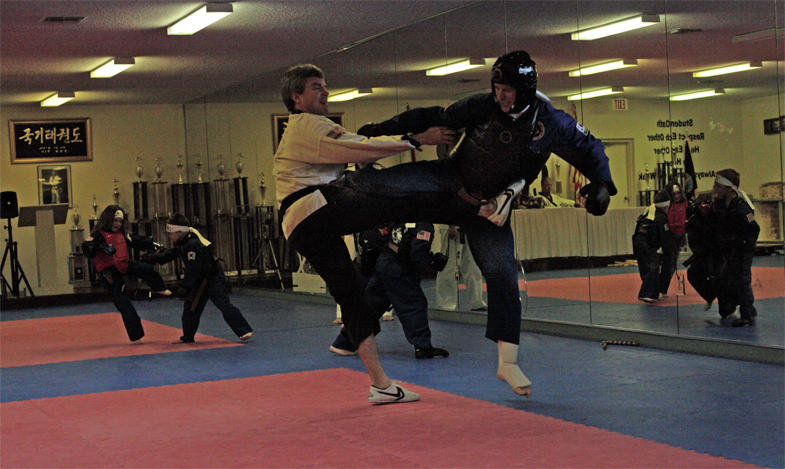 Feb 2006 Belt Test Rick Throwing Kick Sparring Black Belt.jpg