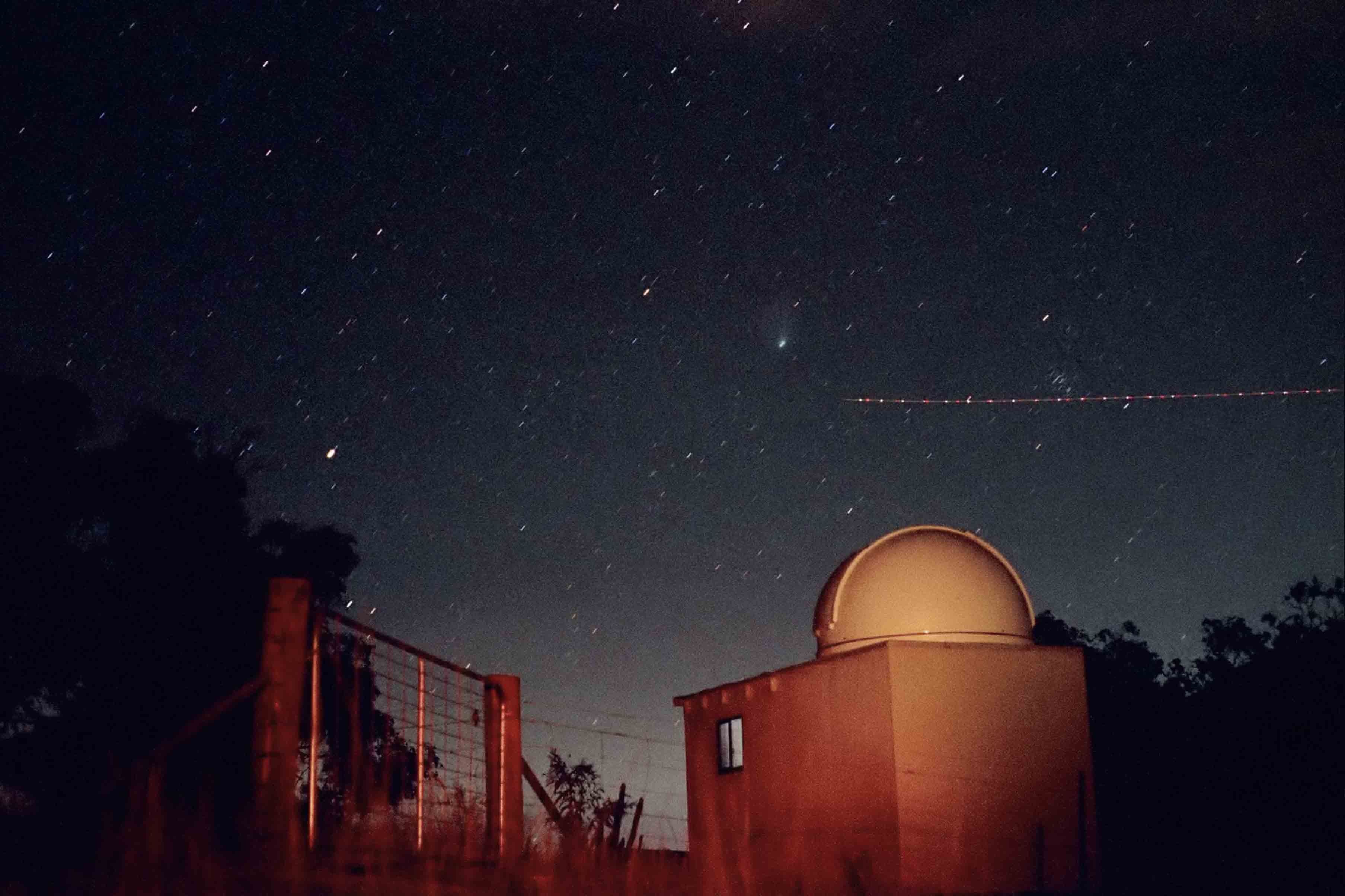 Comet, plane and Beehive cluster over Mt Campbell Observatory