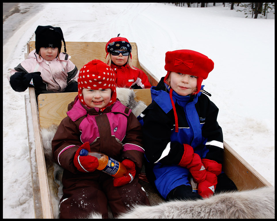 Happy Kaamanen children (towed by snow-mobile)