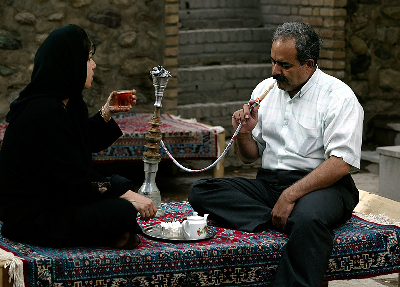 Smoking waterpipe in gardens of Fin (Kashan)