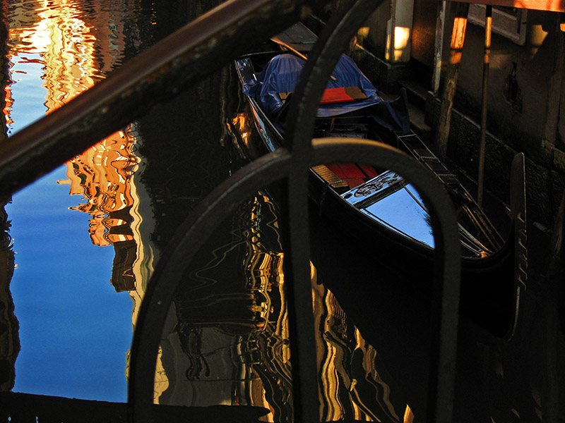 Gondola  and reflections through a bridge railing .. 3130