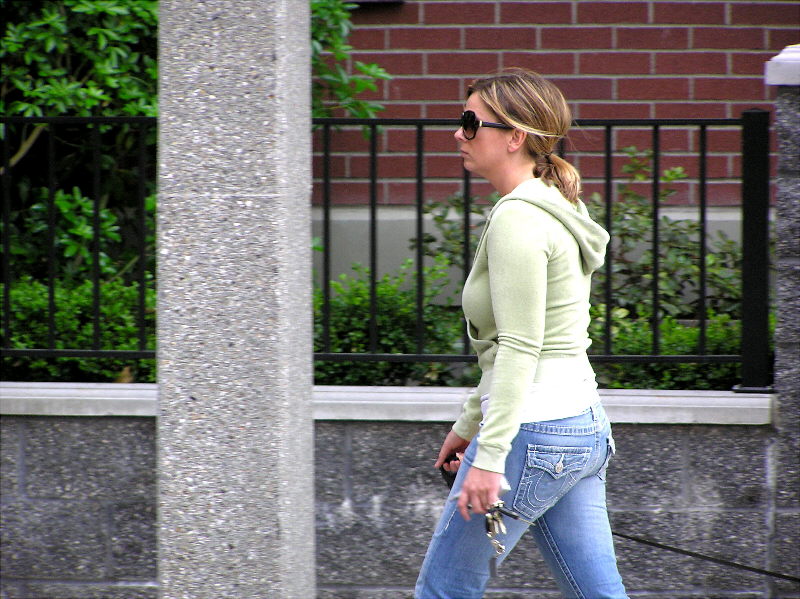 Woman walking near apartments