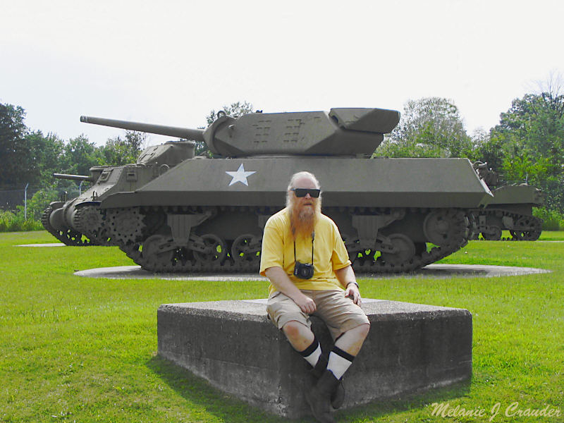 Sitting on a rock by a tank.jpg(445)