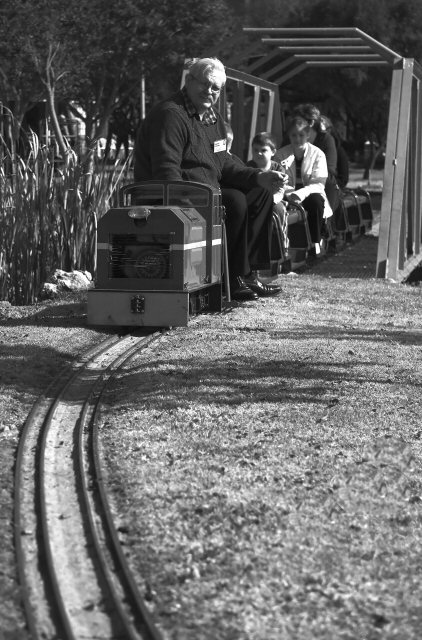 Xtremely Greyscale Train Driver In Repose On Leading Lines