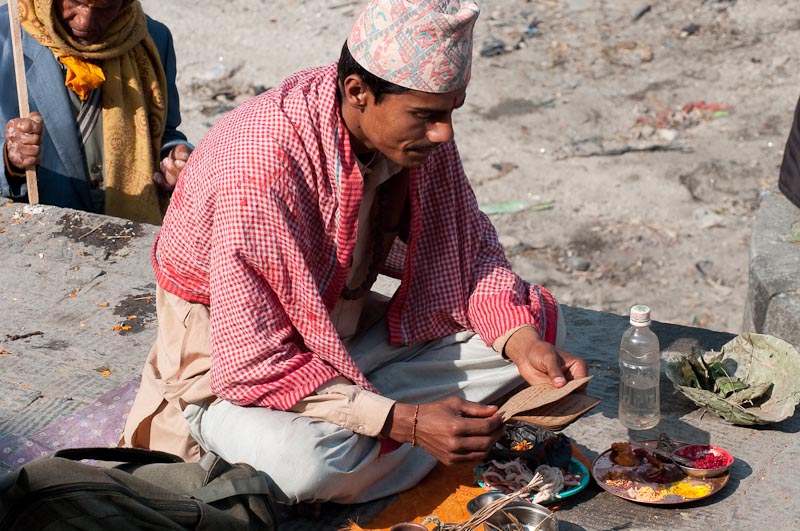 A priest reading Hindu scriptures