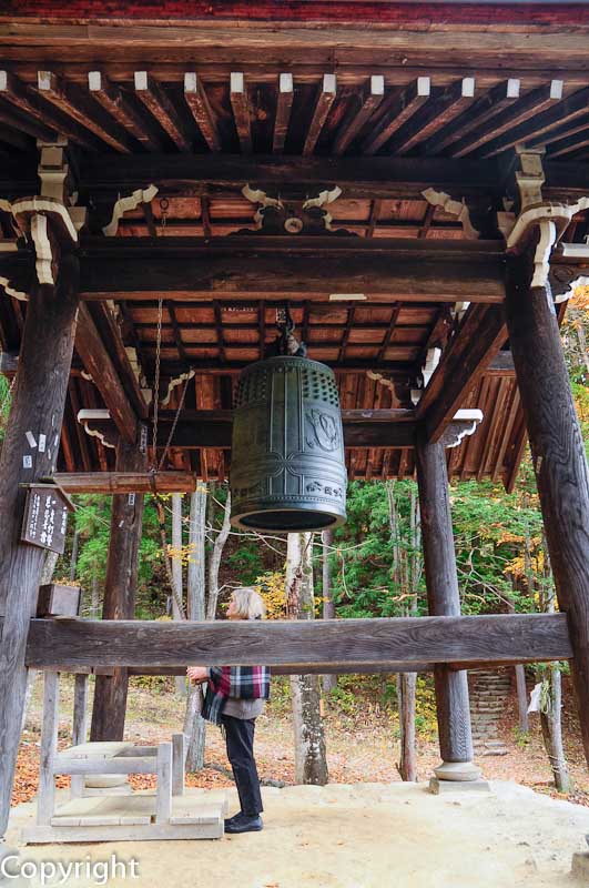 Belltower below a shrine