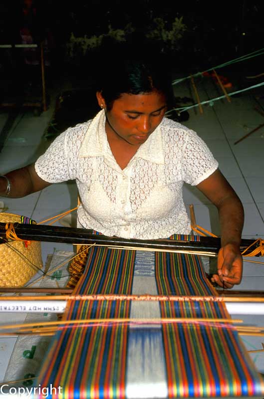 Woman weaving in Dili
