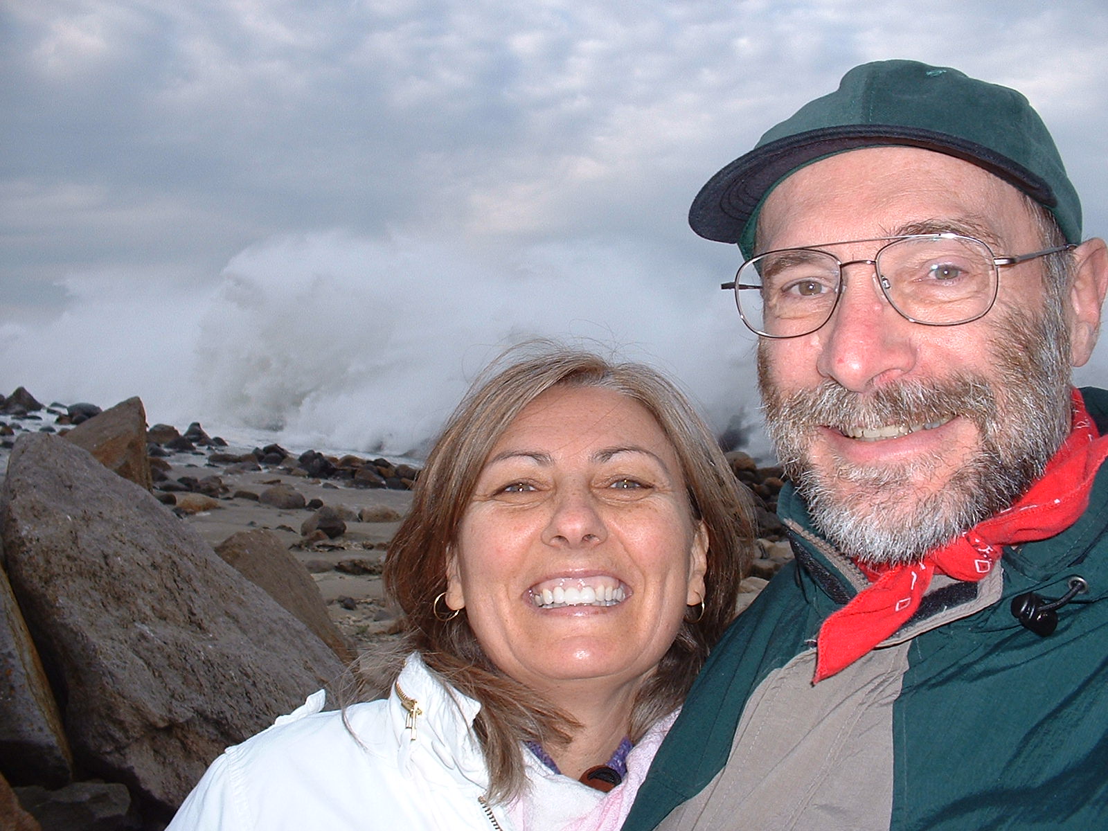Victoria and Garry with surf crashing over the breakwater at Morro Bay