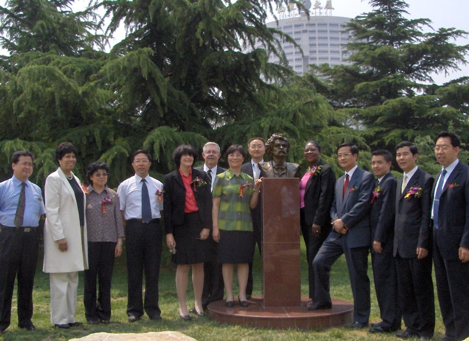 Posing with the statue