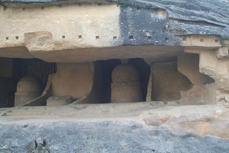 Cave with small stupas
