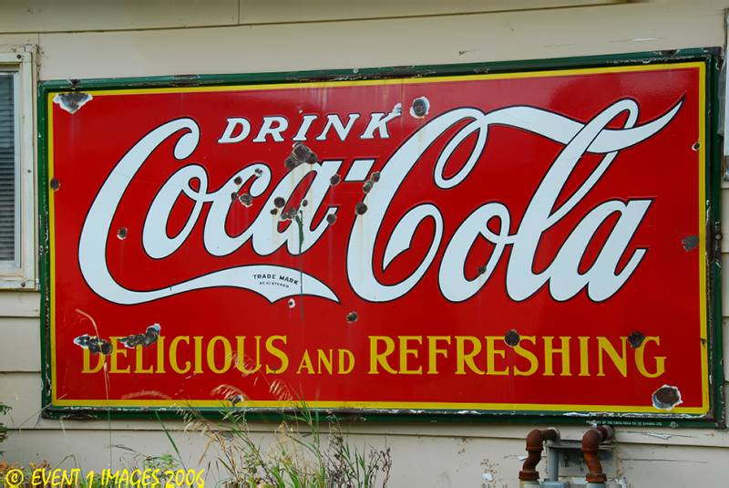 Bullet Ridden Coke Sign