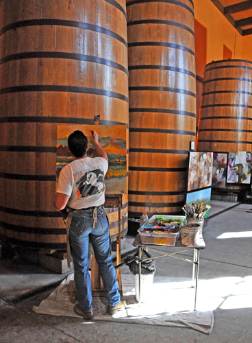 Oil Paintings Being Done in Front of Wine Tanks