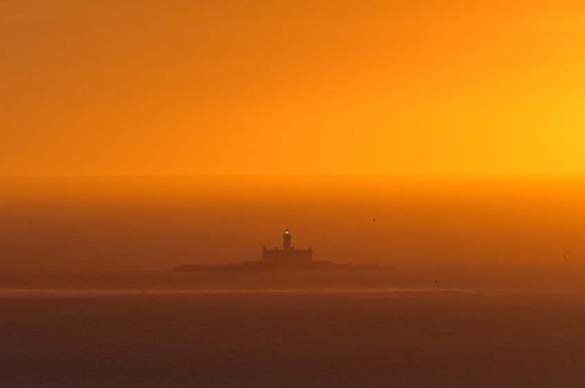 Lighthouse in the Sunset Mist