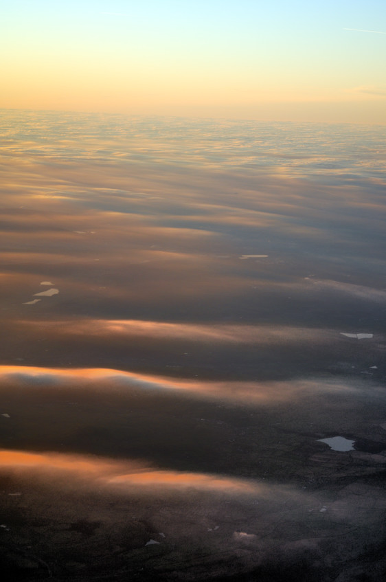 Sunset Over a Sea of Thin Clouds