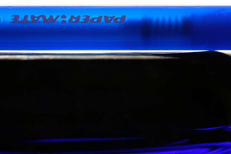 blue pen on blue cup, by Christopher