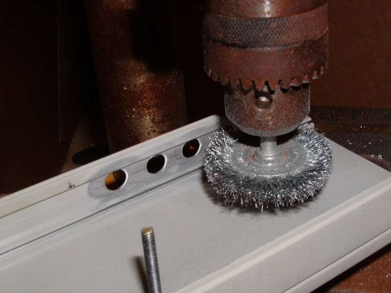 clean up holes w/ wire wheel