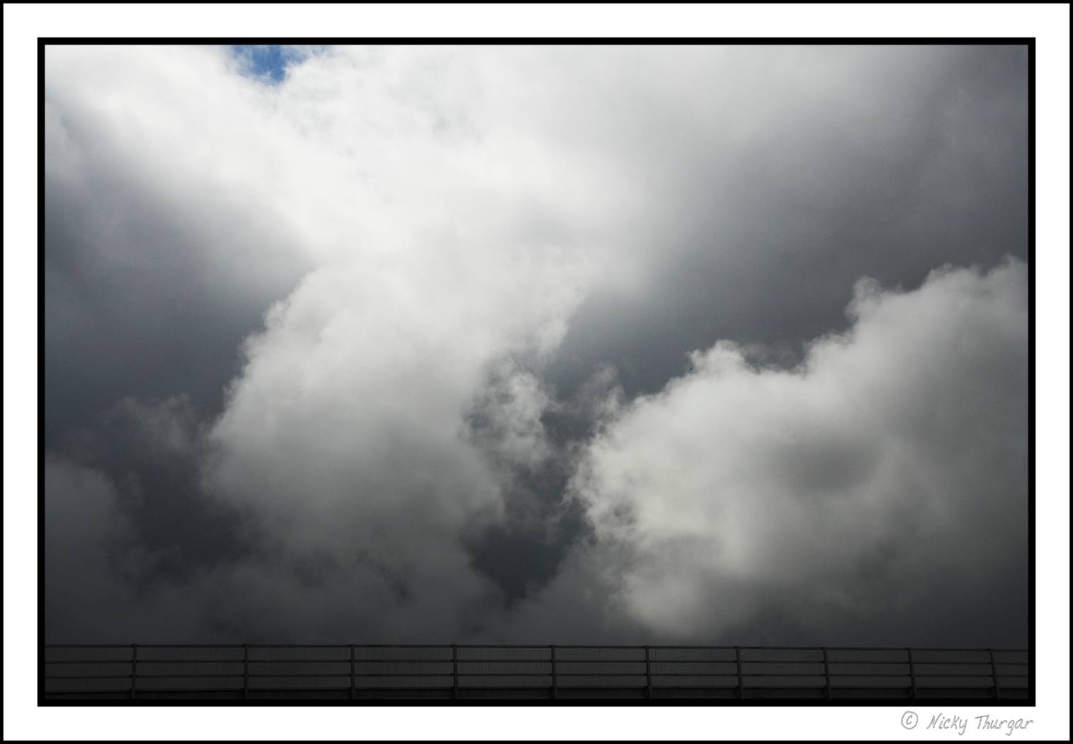 storm clouds = taken from car window