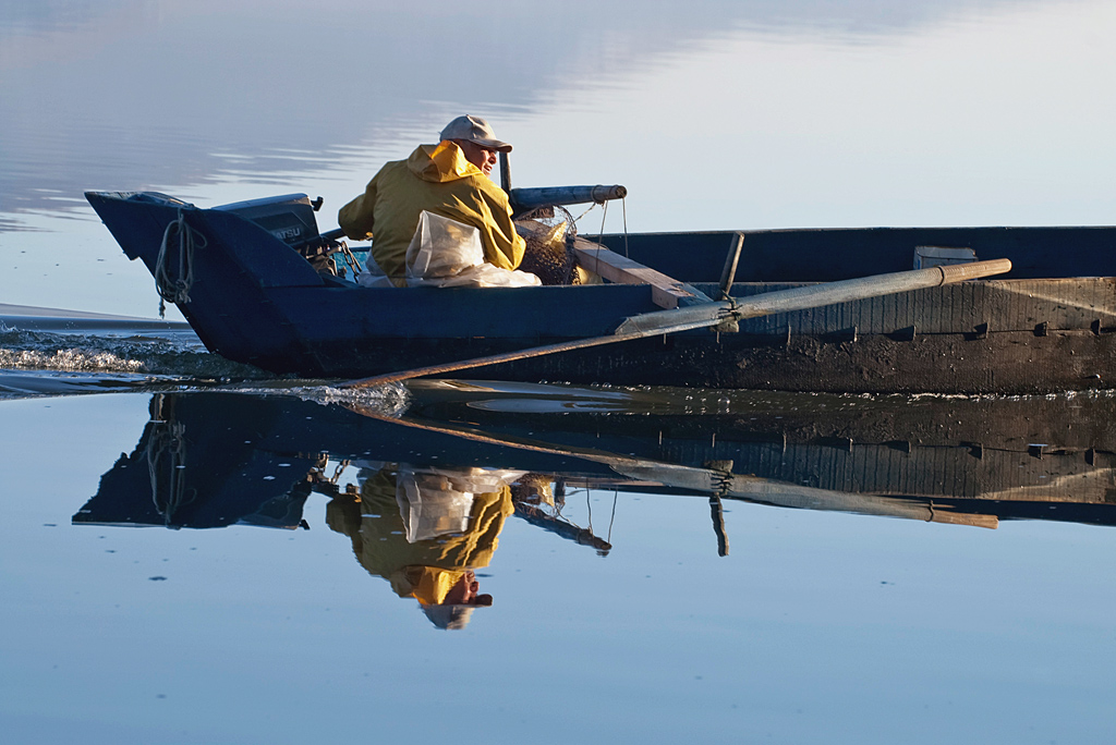 fisherman in Kastoria lake