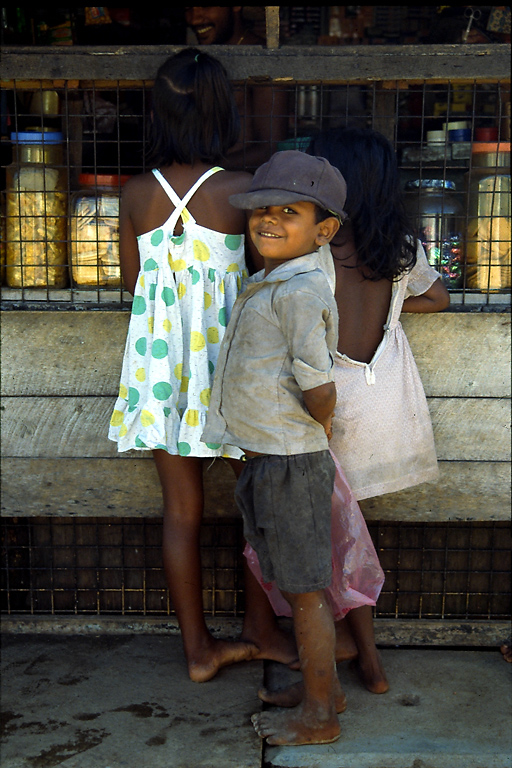 Boy Outside Kiosk