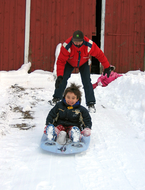 Sleding down the barn hill *