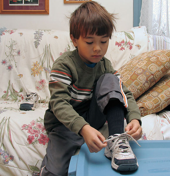 Serious work Tying shoes....