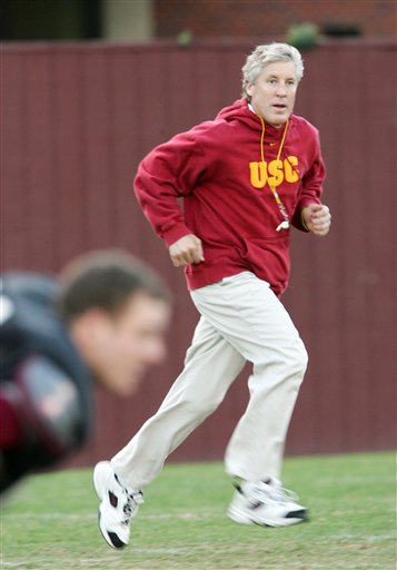 Pete Carroll runs as he oversees practice on the campus in downtown Los Angeles on Tuesday, Nov. 29, 2005.jpg